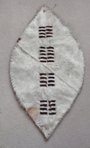 DISPLAY PIECE IN THE SHAPE OF A ZULU SHIELD