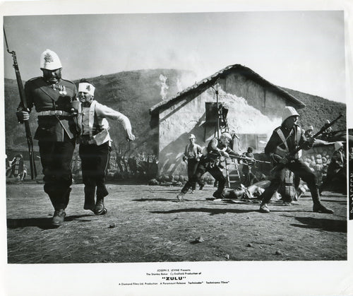 Black & White Press Still from 'ZULU' - Bourne Helping Evacuate Burning Hospital